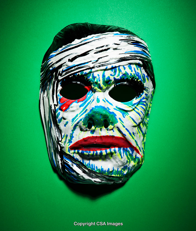 Painted Abstract Mask with Bright Colors on Green Background