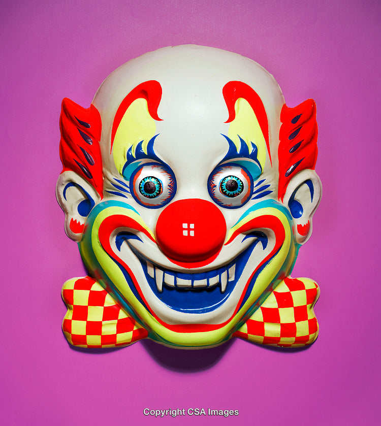 Colorful Clown Mask with Vibrant Colors on a Pink Background