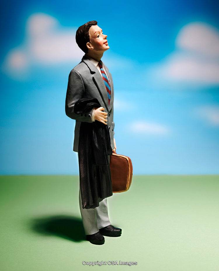 Miniature Businessman Holding Suitcase on Colorful Background