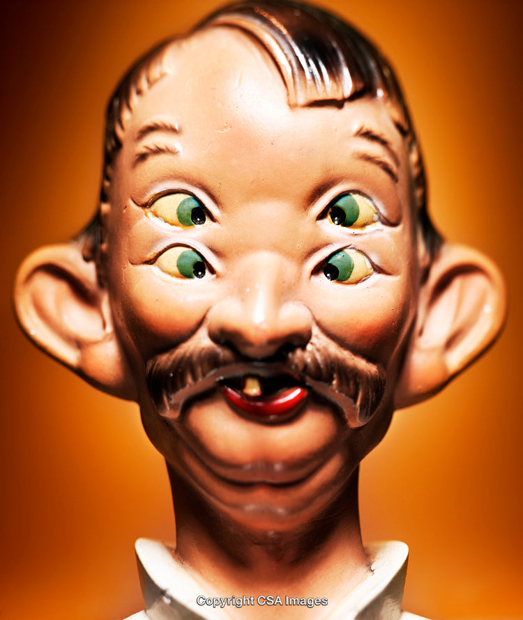 Close-Up of a Unique Plastic Toy Figurine With Multiple Eyes