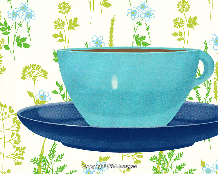 Blue Teacup With Saucer on Floral Patterned Background in Bright Setting