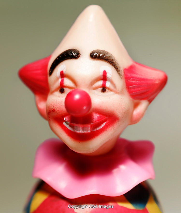 Close-Up of a Smiling Clown Toy Figurine With Bright Red Features