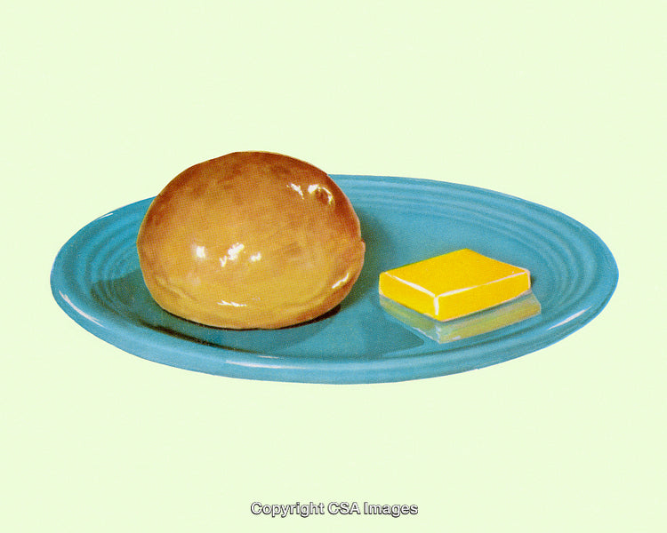 Golden Bread Bun With Butter on a Textured Ceramic Plate