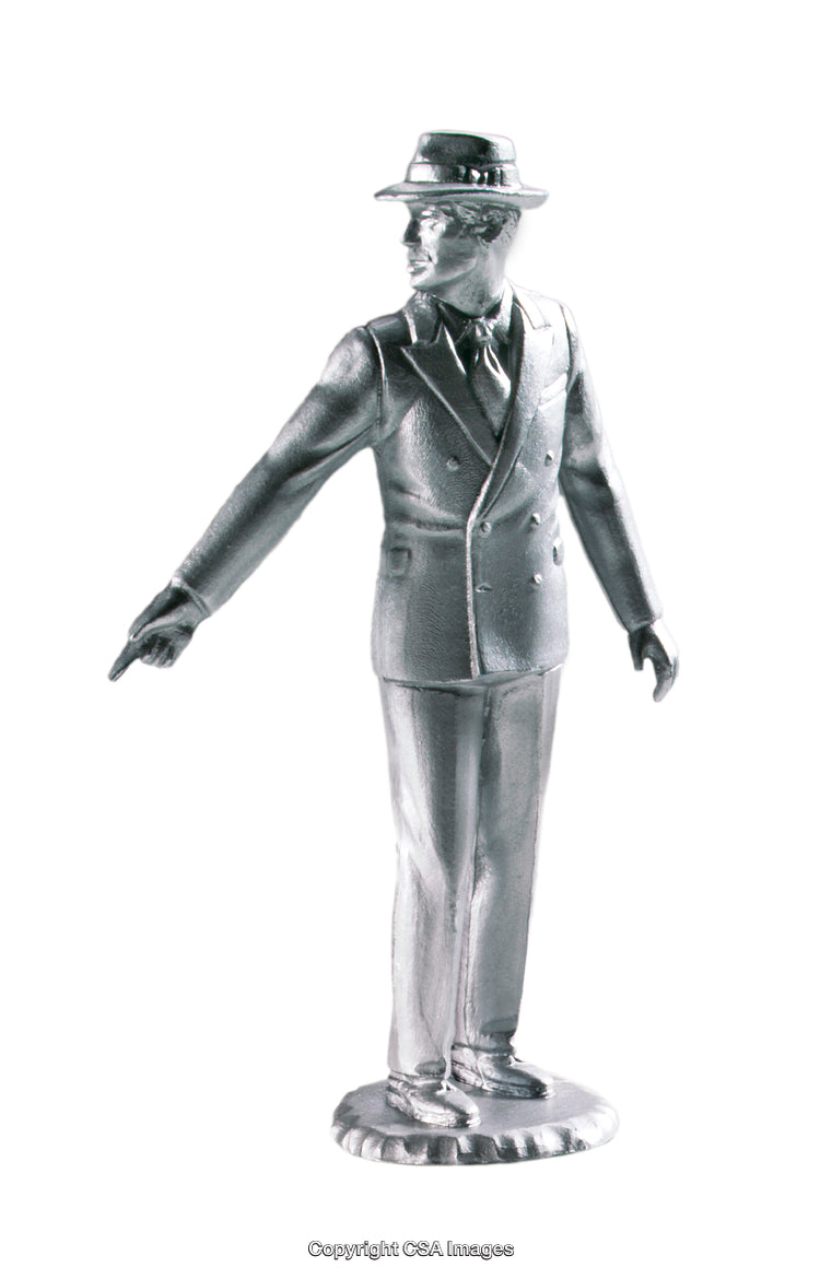 Metallic Figure of a Man in a Suit and Hat Pointing Forward