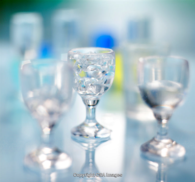 Crystal Clear Glasses with Ice Cubes on a Reflective Surface