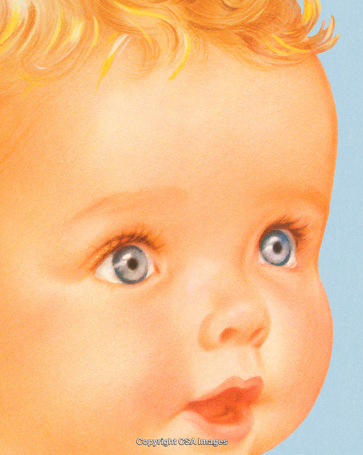 Close-Up of a Baby's Face With Bright Eyes and Golden Hair