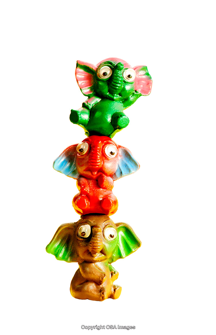 Colorful Stacked Toy Elephants With Whimsical Expressions on White Background