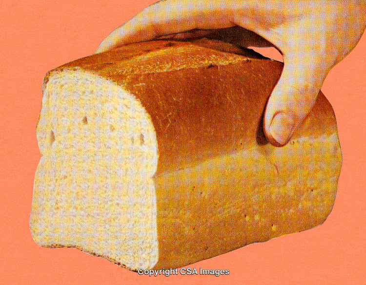 Loaf of Bread Held Against a Vibrant Background