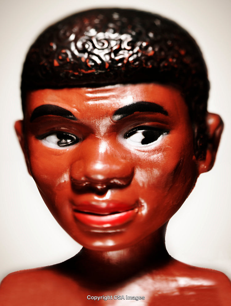 Close-Up of a Decorative Plastic Figurine with Brightly Painted Features