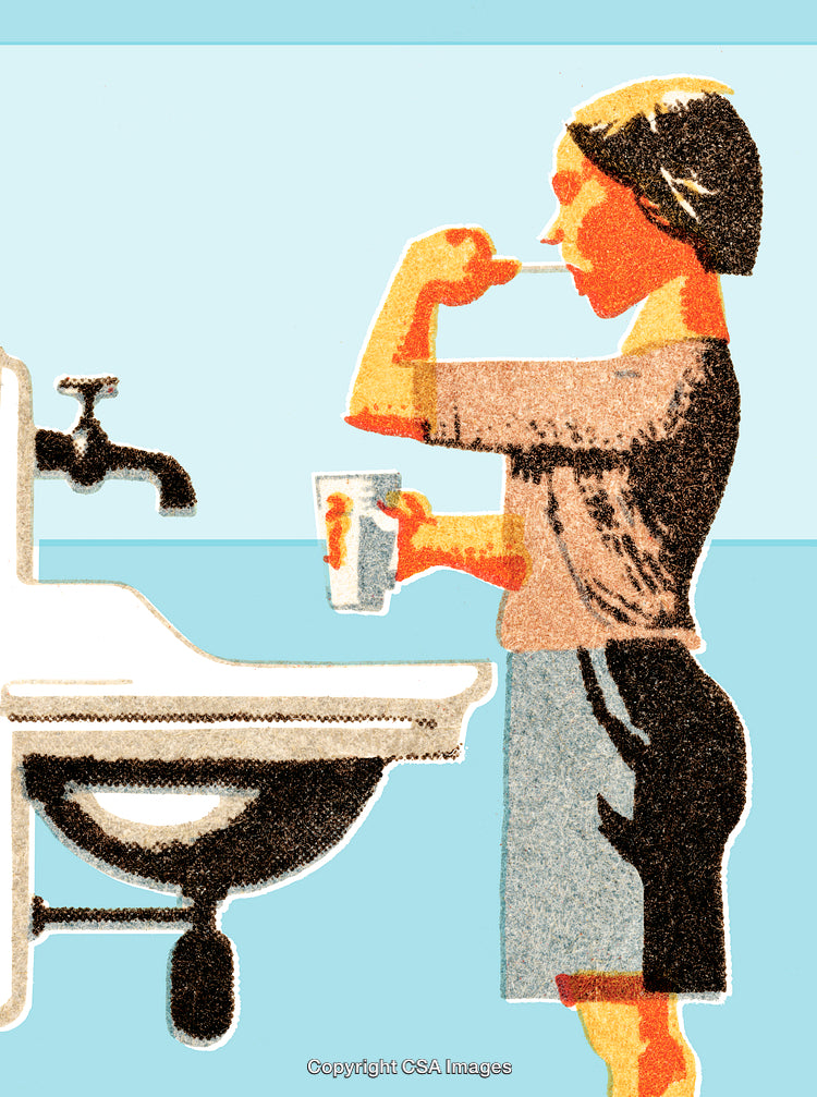 Woman Brushing Her Teeth at Home in a Bathroom Setting