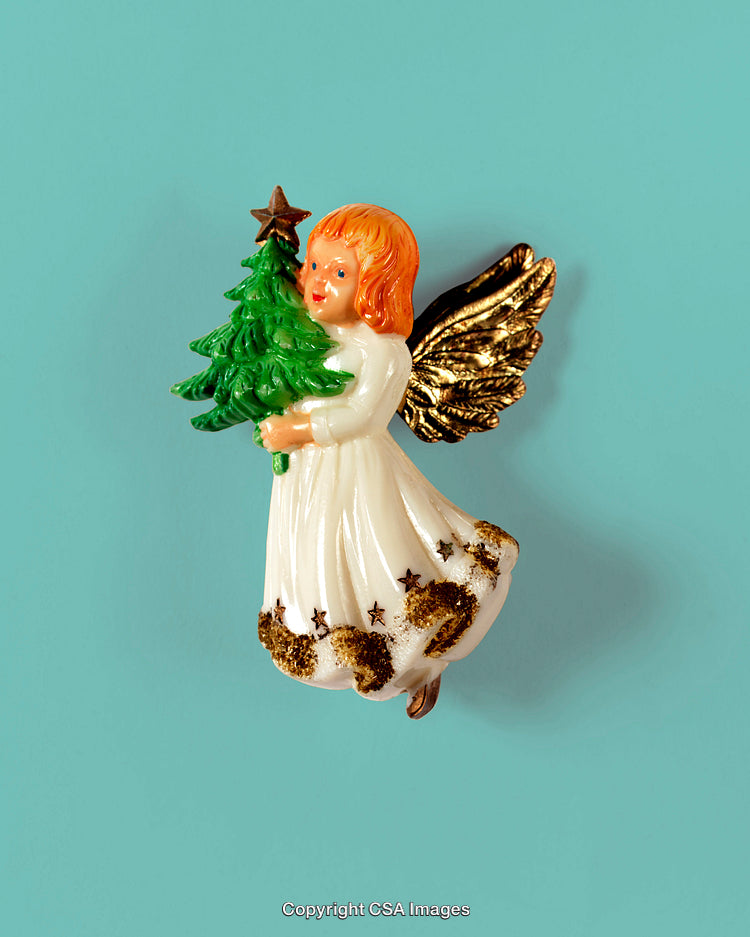 Gold-Winged Angel Holding a Christmas Tree Decoration on Turquoise Background