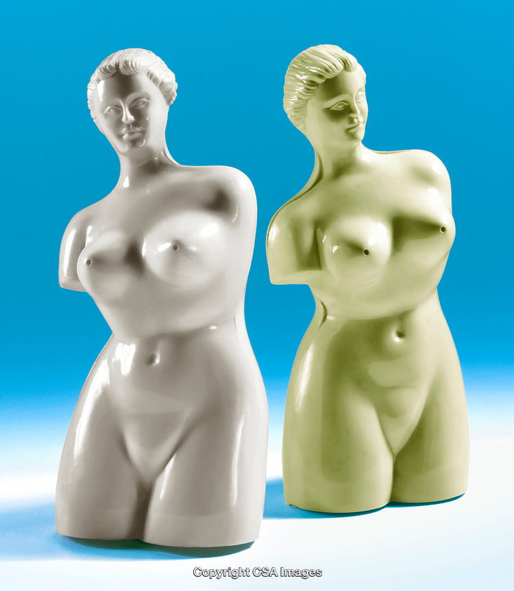 Two Female Figurines in White and Green Against Blue Background