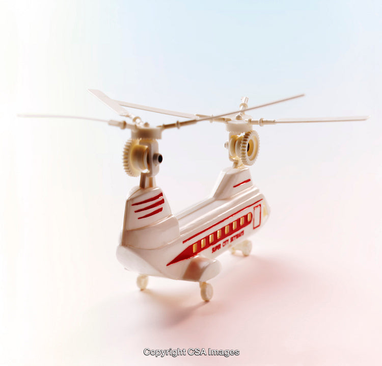 Close-Up of a White and Red Toy Helicopter With a Clean Background