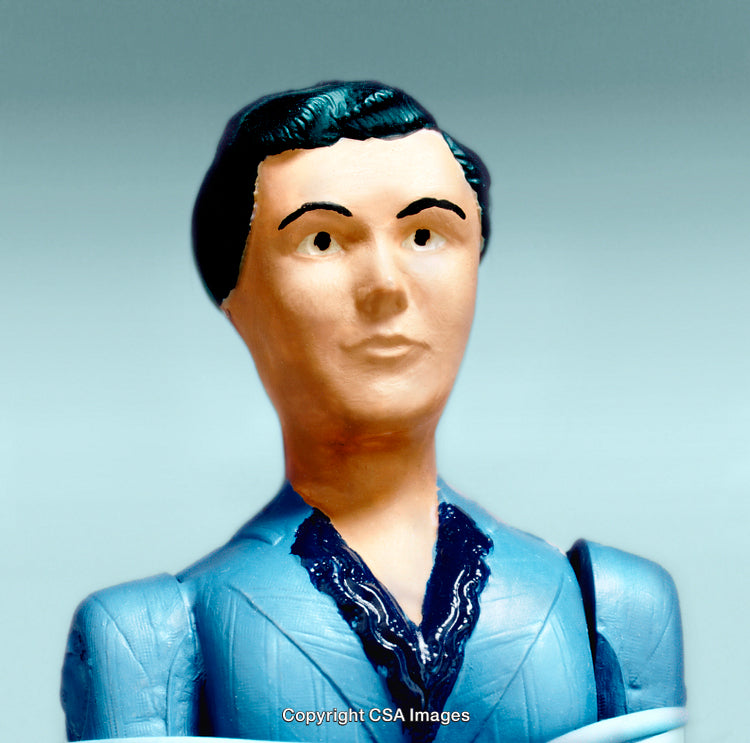 Close-Up of Vintage Plastic Toy Figure with Detailed Blue Suit