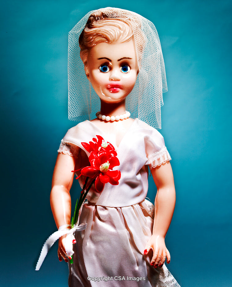 Retro Doll Dressed as Bride Holding Bouquet in Elegant Pose