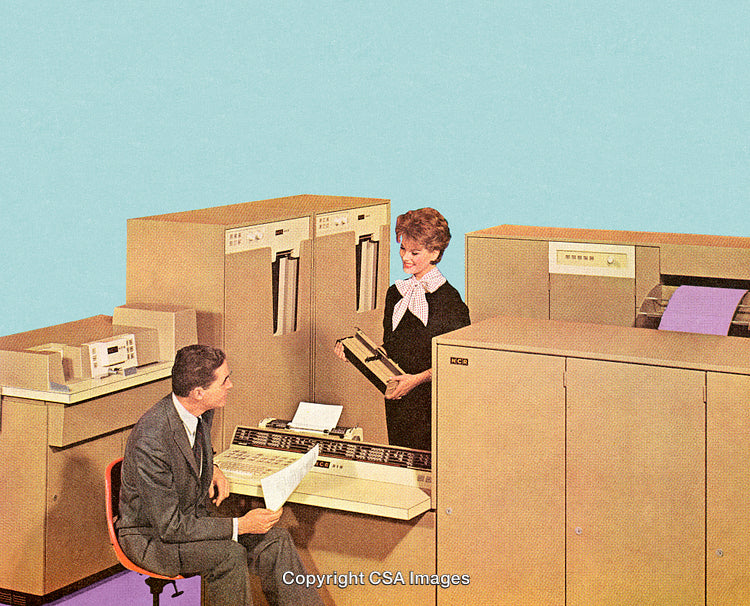 Retro Office Setting Featuring Early Computers and Office Equipment