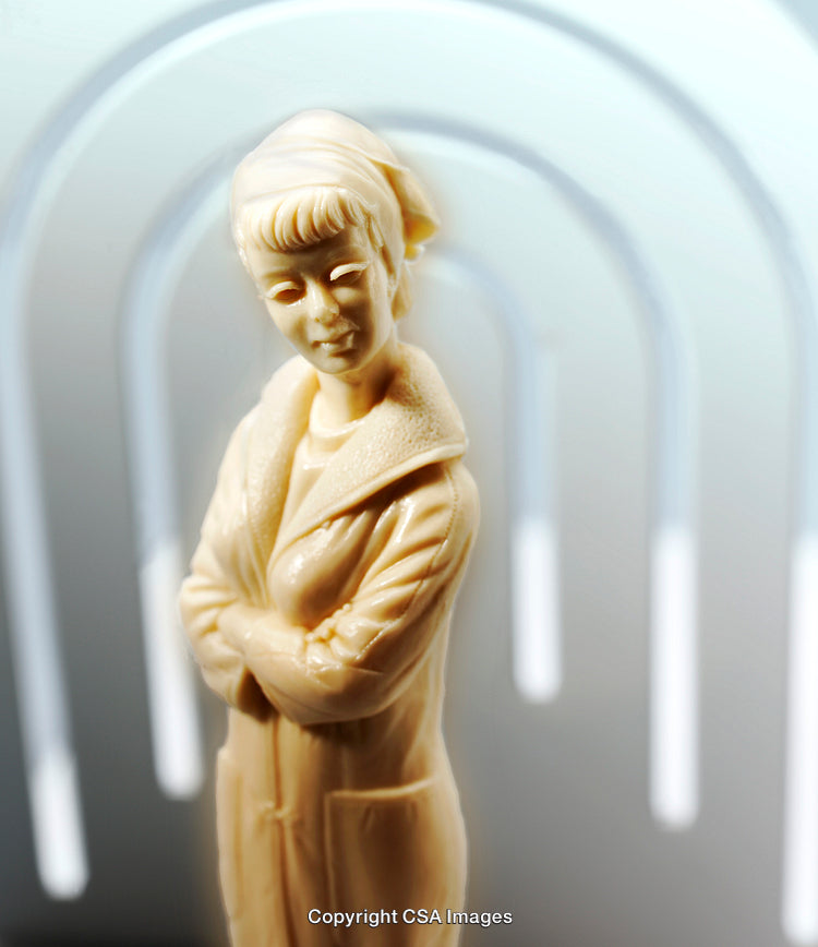Elegant Figurine of a Woman in a Minimalist Background Setting