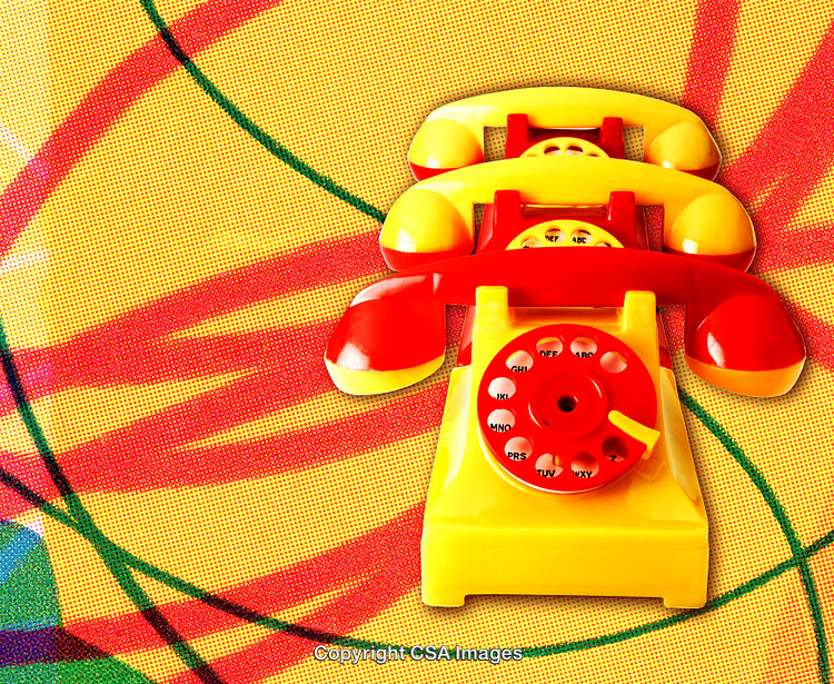 Colorful Vintage Plastic Telephones on a Vibrant Abstract Background