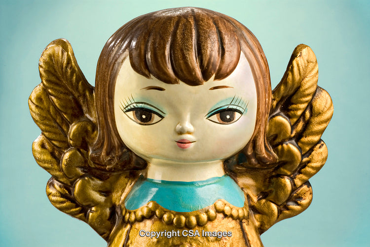 Golden Angel Figurine with Blue Outfit Against a Soft Blue Background