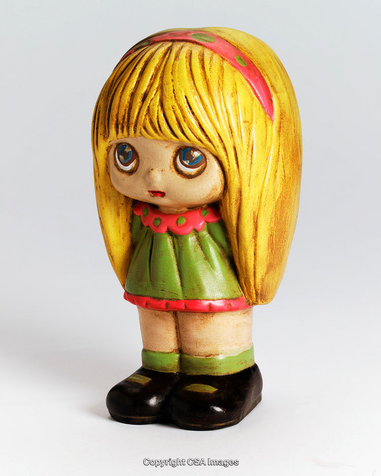 Vintage Doll Figurine With Big Eyes and Retro Colors on White Background