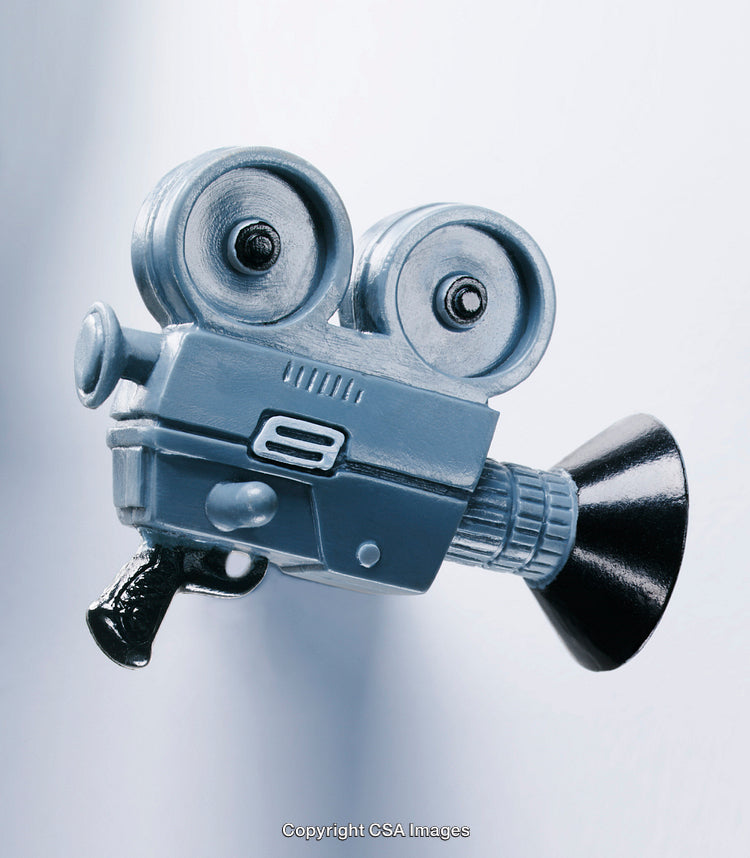 Close-Up of a Vintage Camera-Shaped Plastic Toy on White Background