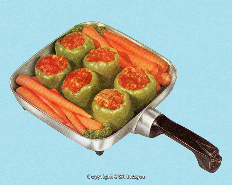 Stuffed Bell Peppers and Carrots in a Skillet on Blue Background