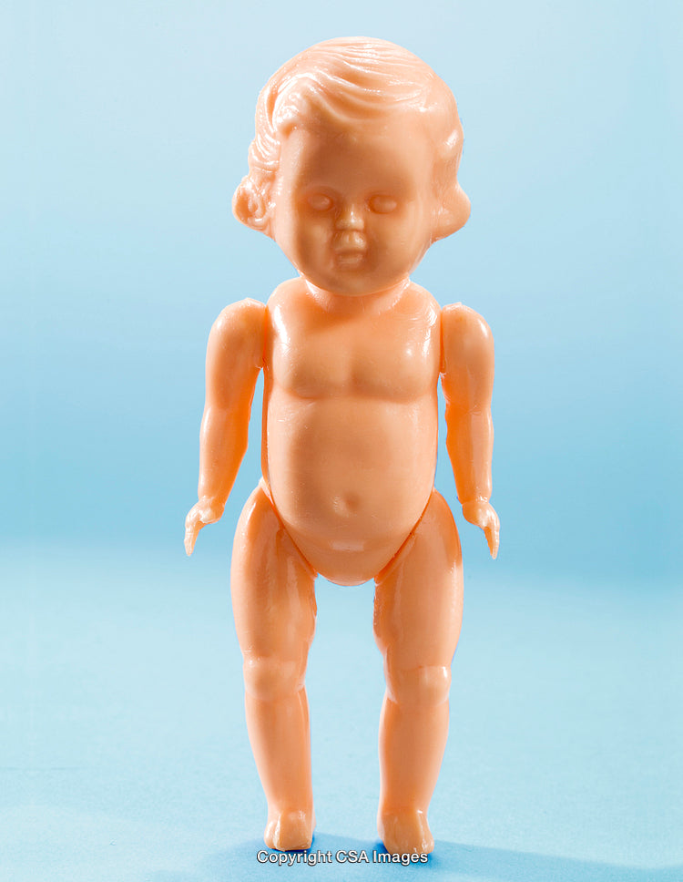 Vintage Blonde Plastic Doll on Blue Studio Background
