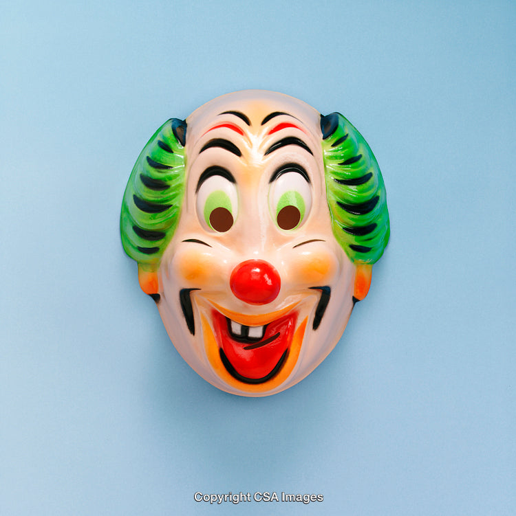 Clown-Themed Plastic Mask Against a Light Blue Background