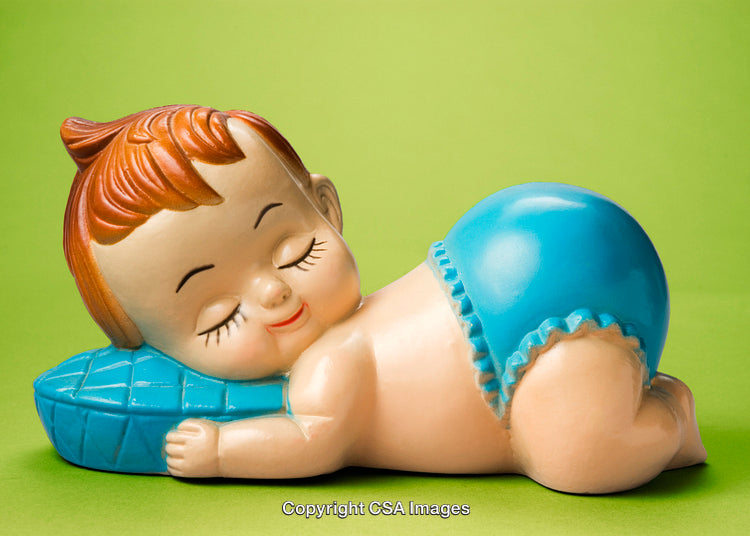Vintage Ceramic Baby Figurine Sleeping Peacefully on a Blue Pillow