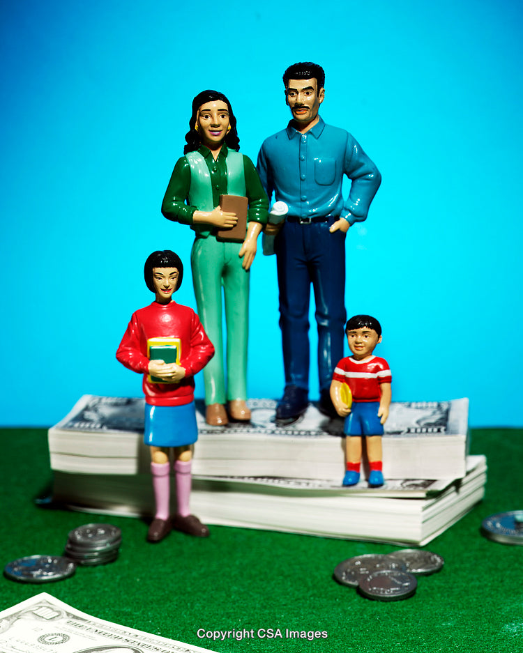 Plastic Family Figures on Money Representing Financial Planning