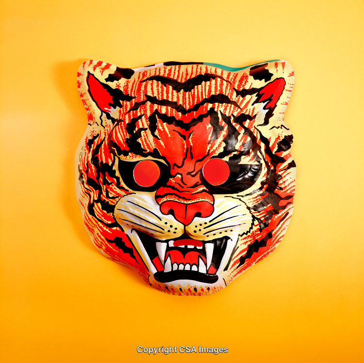 Colorful Tiger Mask With Bold Features on Vibrant Yellow Background