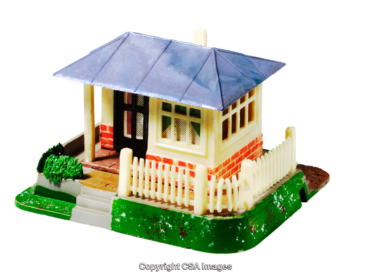 Plastic Model House With Blue Roof and Red Brick Walls