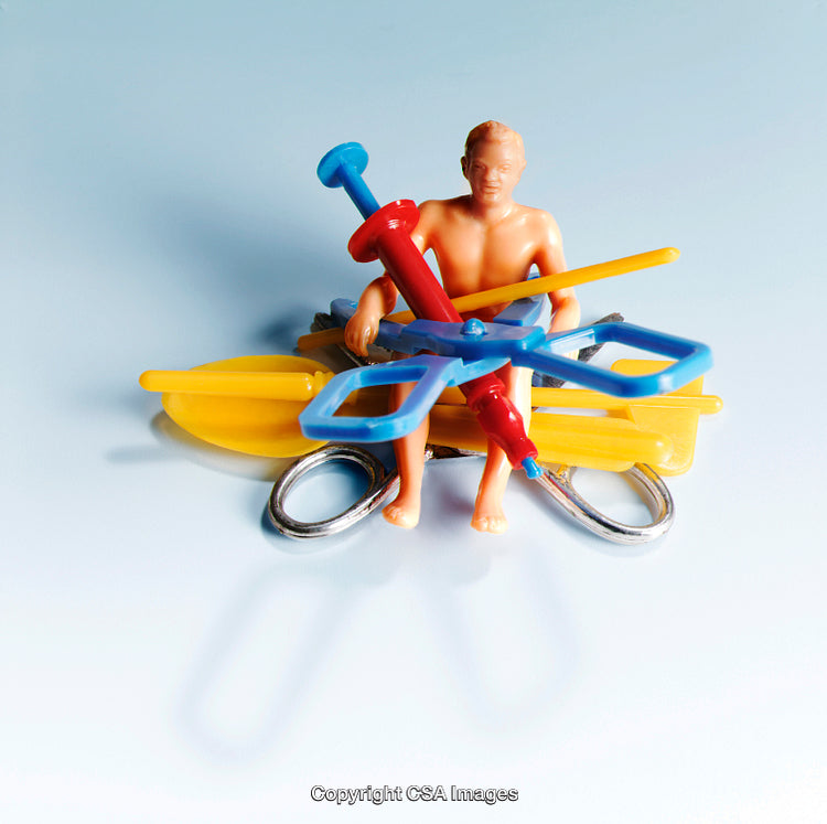 Unique Arrangement of Plastic Figurine and Colorful Toys on Light Background