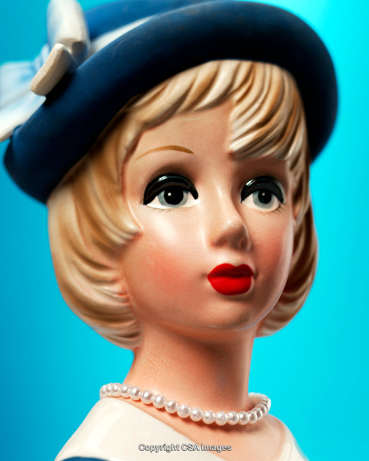 Vintage Porcelain Figurine of a Woman Wearing Hat and Pearl Necklace