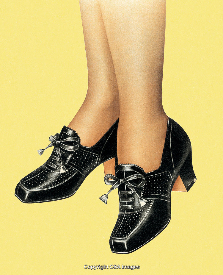 Close-Up of Stylish Black Leather Shoes with Decorative Bow Accents