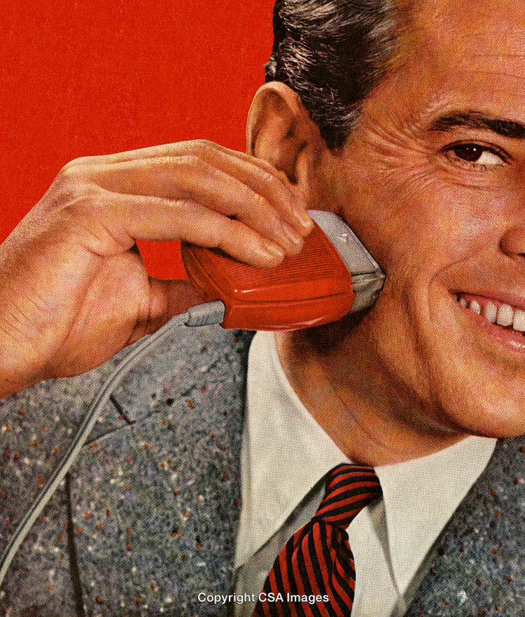 Close-Up of Man Using Electric Shaver with Retro Aesthetic