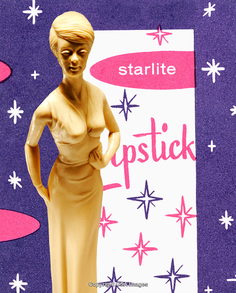 Retro-Themed Golden Plastic Figure Against Vintage Lipstick Advert