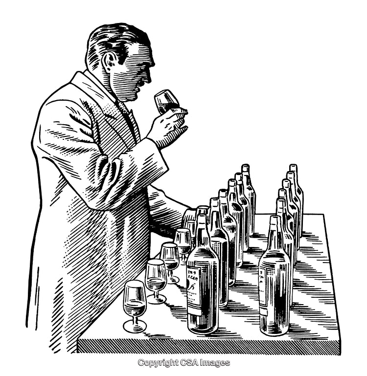 Man Engaged in Professional Beverage Tasting Session with Bottles on Table