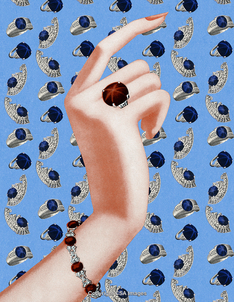 Elegant Jewelry Display Featuring Rings and a Bracelet on Artistic Background