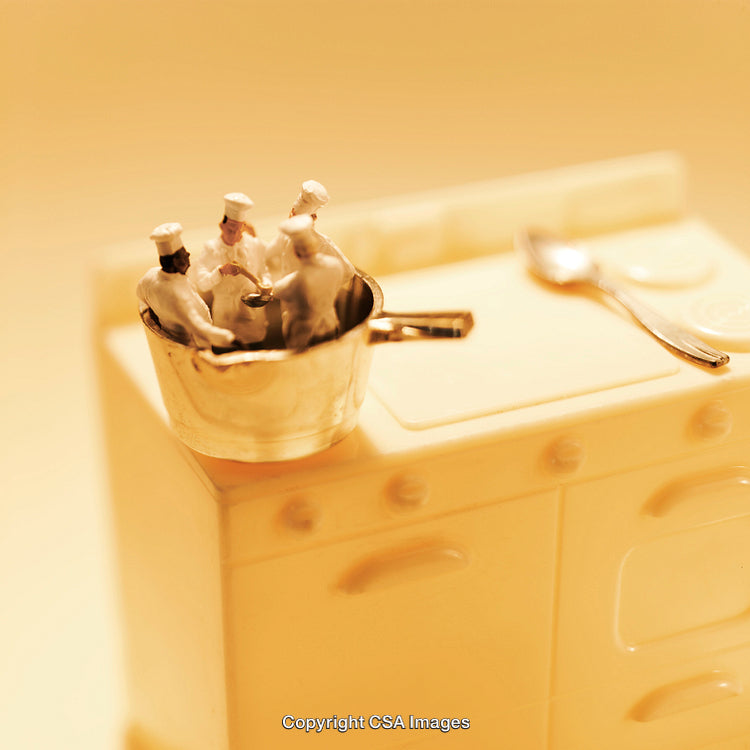 Miniature Chefs Cooking in a Tiny Pot on a Yellow Kitchen Setup