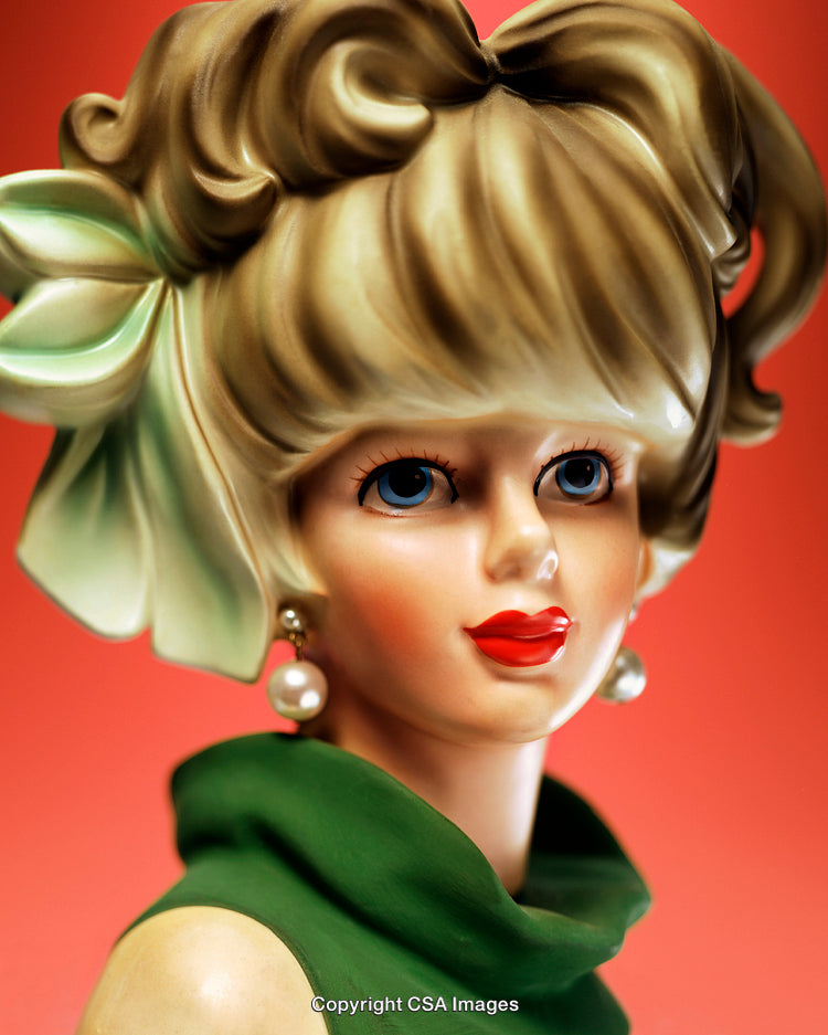 Stylish Vintage Figurine Featuring Elegant Fashion and Retro Colors