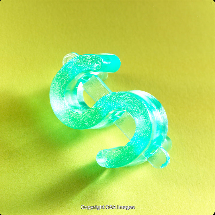 Close-Up of Green Plastic Toy on Vibrant Yellow Background