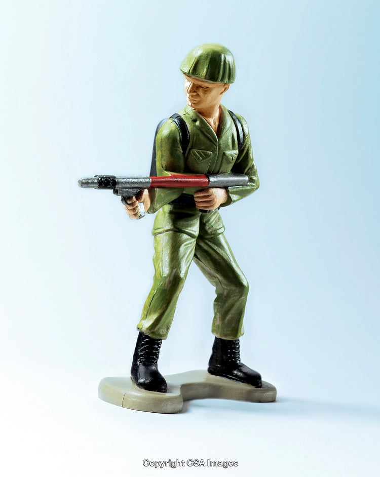 Green Plastic Soldier Figure Holding a Weapon in a Stance