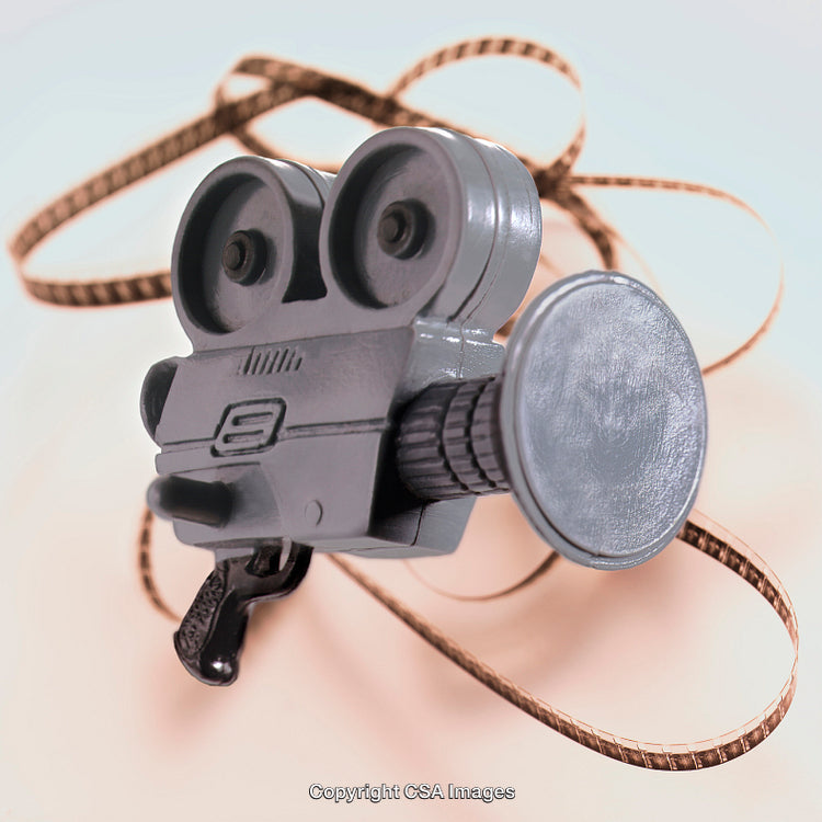 Close-Up of a Vintage Film Camera Toy with Film Strip