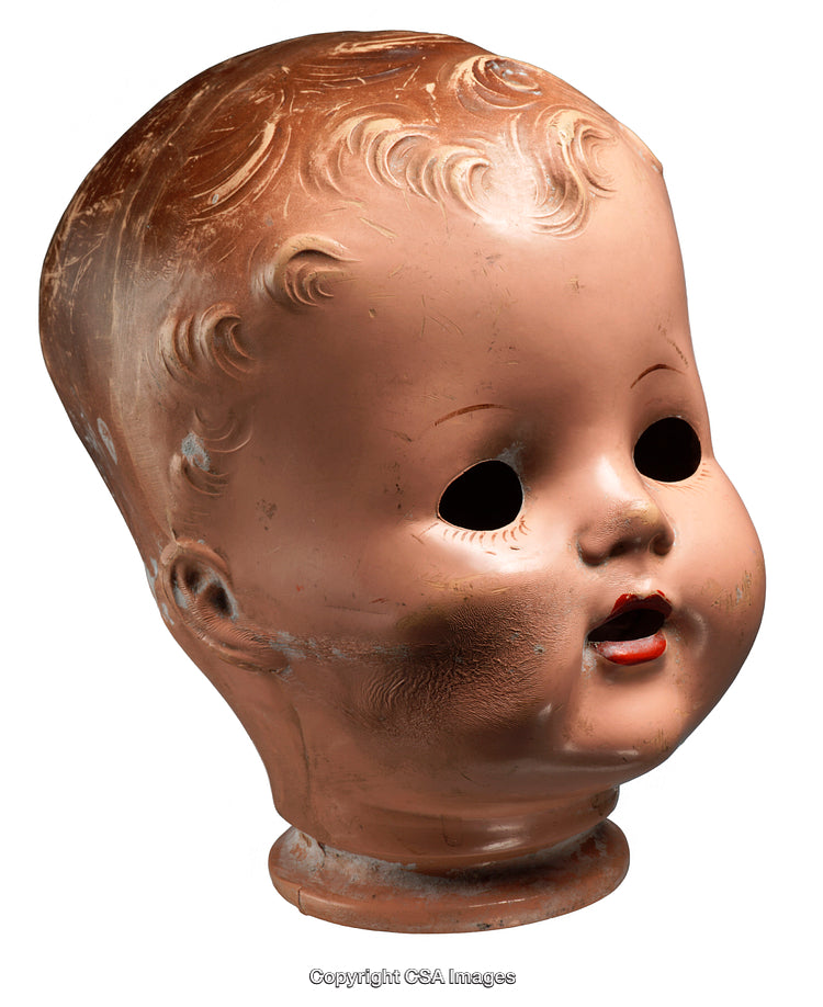 Vintage Worn Doll Head with Empty Eyes and Chipped Paint
