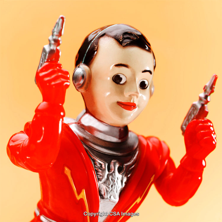 Vintage Robot Toy Figurine in Red with Dual Ray Guns on Orange Background