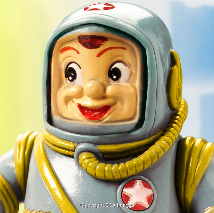 Cheerful Plastic Astronaut Toy with Retro Details and a Bright Smile
