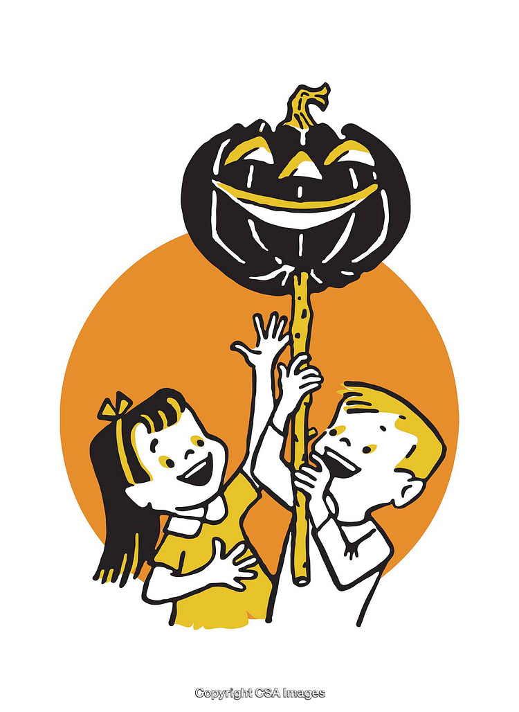 Children Smiling as They Raise a Jack-O-Lantern on a Halloween Night