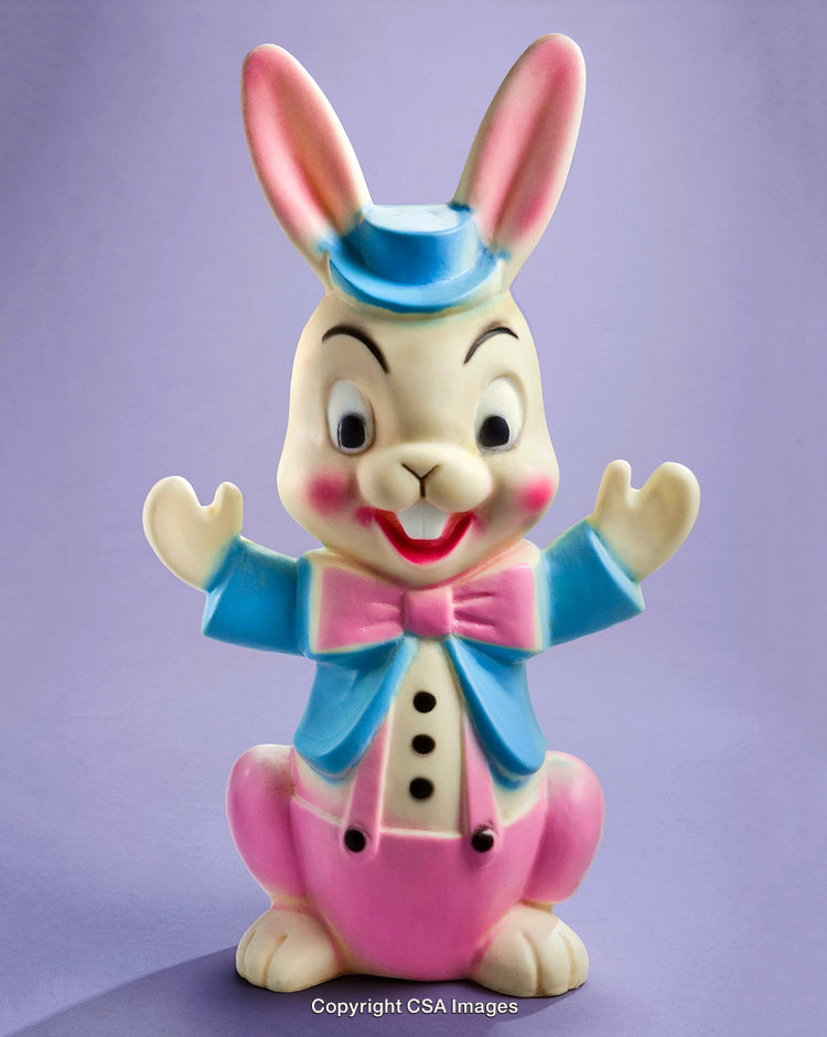 Vintage Style Plastic Bunny Toy with Pink Outfit on Purple Background