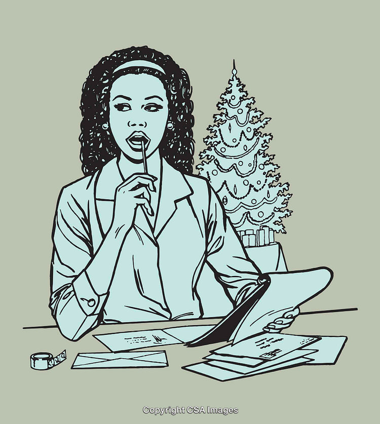 Thoughtful Woman Writing Holiday Cards in Front of a Christmas Tree